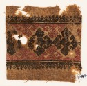 Textile fragment with three diamond-shapes and hooks