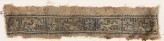Textile fragment with eight-pointed stars and inscription