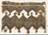 Textile fragment with chevrons and linked trefoils