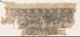 Textile fragment with diamond-shapes containing stars