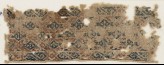 Textile fragment with diamond-shapes set into a diagonal grid (EA1984.567)