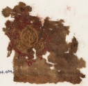 Textile fragment with oval containing a trefoil