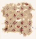 Textile fragment with rosettes, linked circles or hexagons, and inscription (EA1984.74)