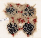 Textile fragment with lion and grid of quatrefoil flowers