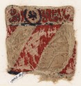 Textile fragment with lion and inscription, possibly from a bag or pocket