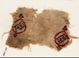 Textile fragment with blazons and inscription