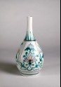 Bottle with four panels depicting lotus flowers and insects