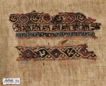 Textile fragment with interlacing roundels, birds, and pseudo-inscription (EA1988.51)