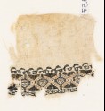 Textile fragment with pseudo-inscription border
