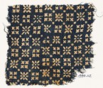 Textile fragment with rosettes, dots, and squares (EA1990.112)