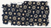 Textile fragment with rosettes, stars, and dots (EA1990.120)