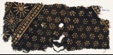 Textile fragment with rosettes and band with floral shapes (EA1990.121)