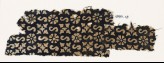 Textile fragment with S-shapes, rosettes, and quatrefoils