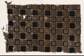 Textile fragment with linked squares, stylized flower-heads, and lines with dots (EA1990.145)
