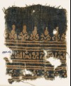 Textile fragment with inscription, rosettes, and stylized trees and palmettes