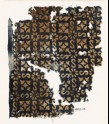 Textile fragment with S-shapes, rosettes, and quatrefoils