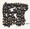 Textile fragment with reversed S-shapes, rosettes, and quatrefoils (EA1990.17)