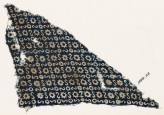 Textile fragment with S-shapes, circles, and stars