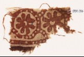 Textile fragment with two rosettes