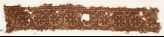 Textile fragment with rosettes in dotted frames (EA1990.337)
