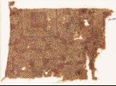 Textile fragment with ornate squares, flowers, and crosses