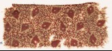 Textile fragment with linked tendrils and flower-heads (EA1990.406)