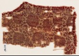 Textile fragment with leaves and flower-heads, possibly from a garment (EA1990.414)