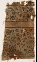 Textile fragment with stylized tree, flowering plants, vine, and flower-heads (EA1990.459)