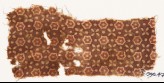 Textile fragment with stars, quatrefoils, and dots (EA1990.473)