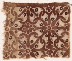 Textile fragment with interlocking spirals or rosettes (EA1990.510)