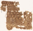 Textile fragment with bands of rosettes in dotted circles, spirals, and diamond-shapes (EA1990.531)