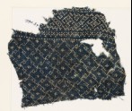 Textile fragment with rosettes and linked S-shapes made of dots (EA1990.57)