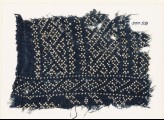 Textile fragment with dots arranged in geometric patterns