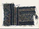 Textile fragment with dots arranged in geometric patterns