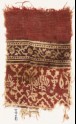 Textile fragment with stylized plants, half-medallions, and crossed tendrils (EA1990.614)