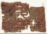 Textile fragment with bands of dotted circles, crossed tendrils, and arches (EA1990.617)