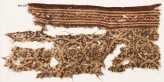 Textile fragment with tendrils arranged as medallions, rosettes, and a vine (EA1990.623)