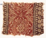 Textile fragment with ornate flower-heads, medallions, and dotted circles (EA1990.626)