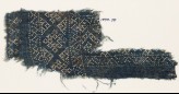 Textile fragment with dots arranged in a geometric pattern