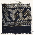 Textile fragment imitating bandhani, or tie-dye, with geometric patterns and arrow-shapes