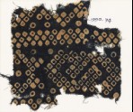 Textile fragment imitating bandhani, or tie-dye, with inverted hooks (EA1990.74)