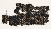 Textile fragment imitating bandhani, or tie-dye, with inverted hooks (EA1990.75)