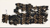 Textile fragment imitating bandhani, or tie-dye, with inverted hooks