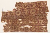 Textile fragment with rosettes and leaves (EA1990.808)