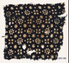 Textile fragment with rosettes, dots, floral shapes, and squares (EA1990.83)