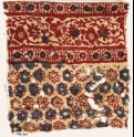 Textile fragment with rosettes and vine