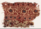Textile fragment with vine and stars (EA1990.906)