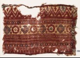 Textile fragment with bands of quatrefoils, rosettes, and chevrons