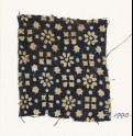 Textile fragment with rosettes, stars, and squares (EA1990.95)