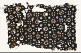 Textile fragment with rosettes, stars, and squares (EA1990.96)